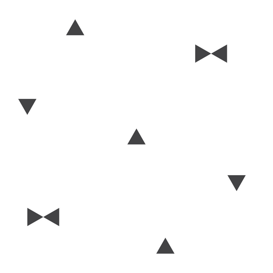 A closeup on a dollhouse wallpaper pattern of little black triangles