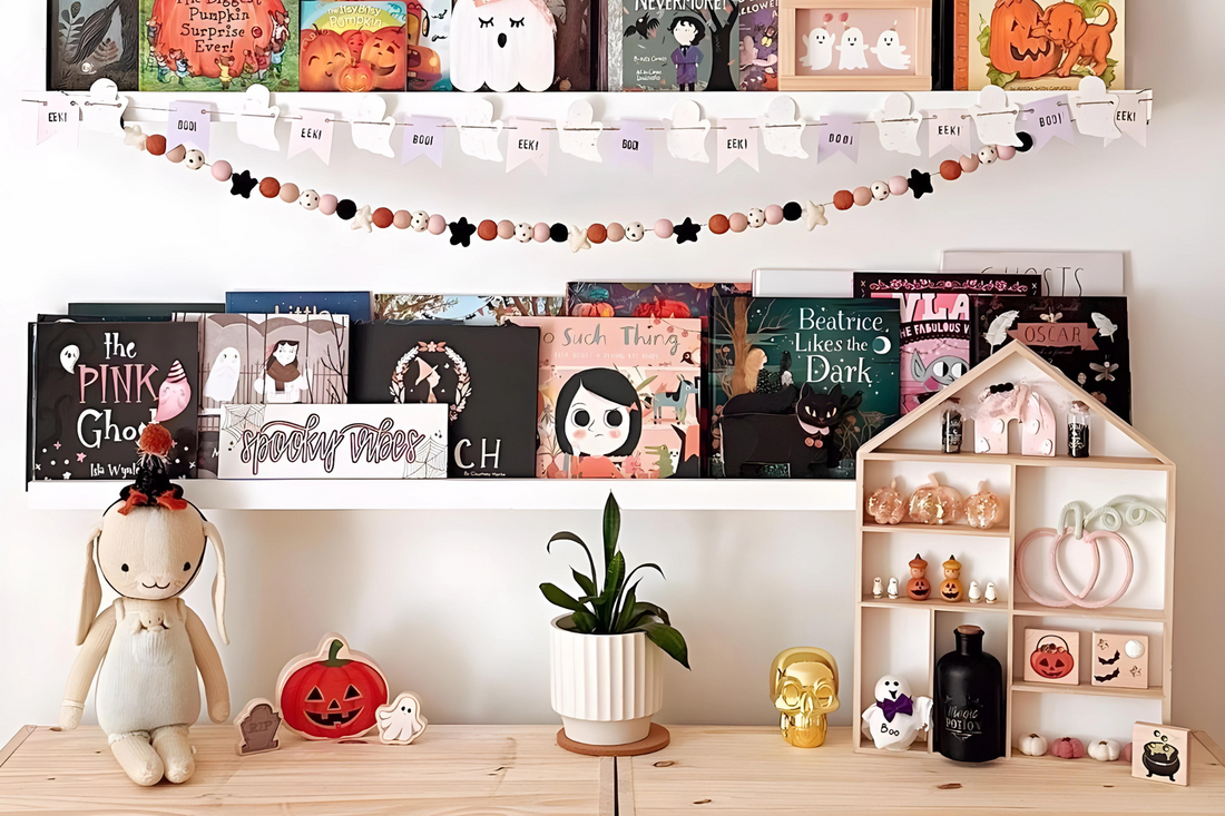 A room with Halloween decoration including a Halloween decorated displayed shelf.
