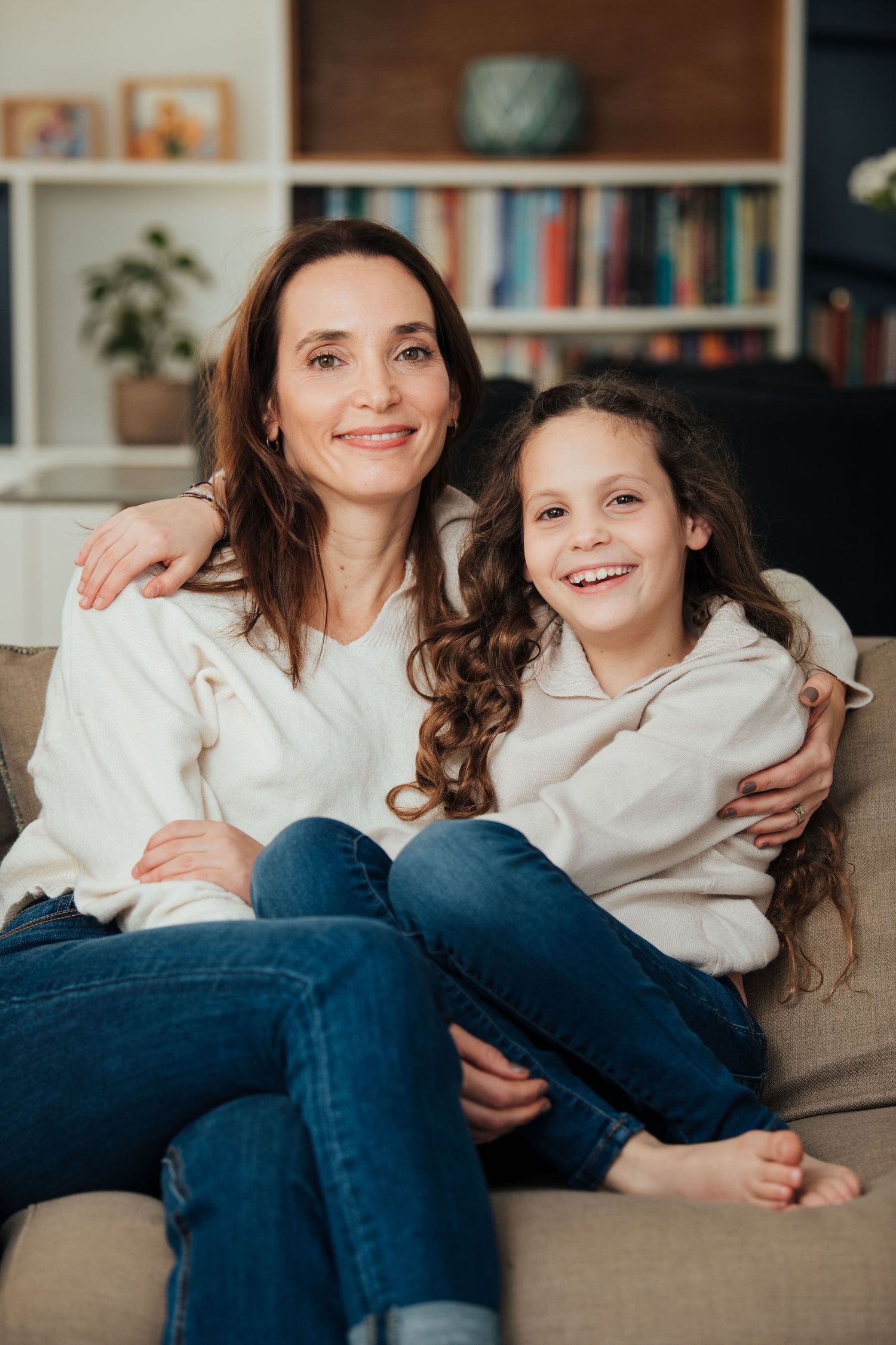 Adi Ben Zeev, the founder of Lovely Little House, and her daughter Ronny hug each other and smile