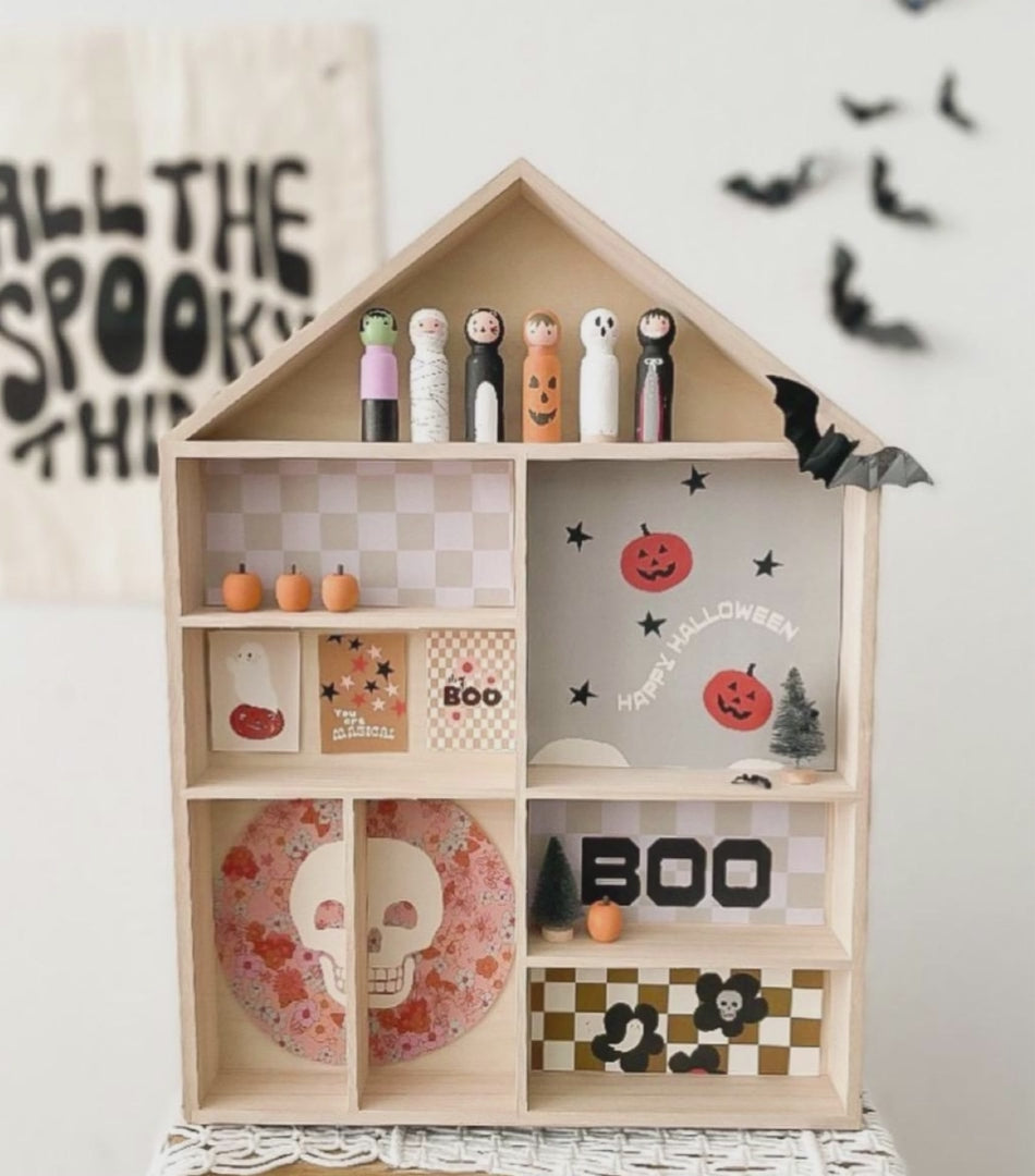 The house shaped shelf is shown in 3 different displays